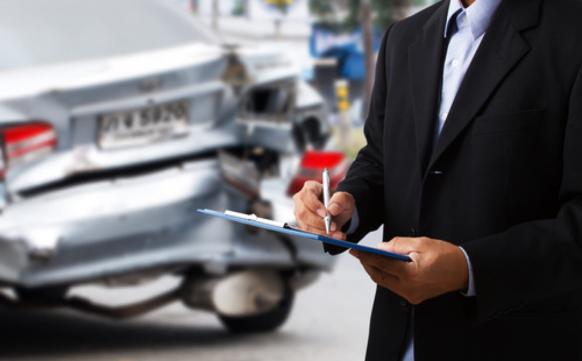 Car insurance agents writing clipboard as a proof of insurance c